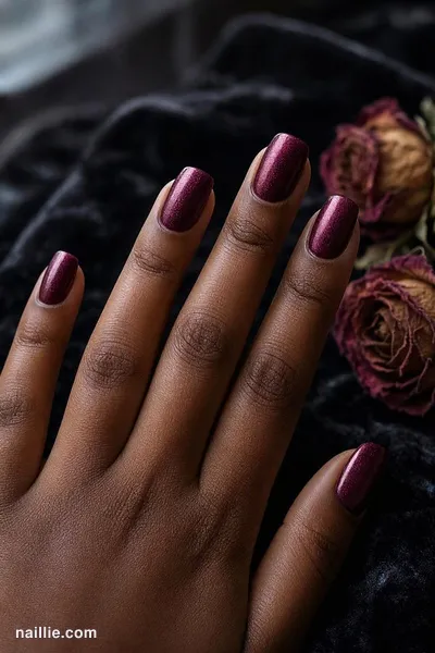 Close-up of short square nails with burgundy polish and a soft velvet shimmer — look 2