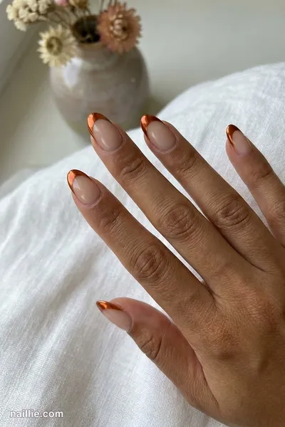 Close-up of oval nails with burnt orange chrome French tips — look 2