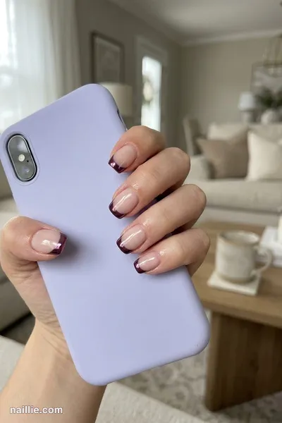 Close-up of short square nails with deep plum chrome French tips — look 3