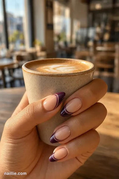 Close-up of almond nails with a deep plum double French line — look 2