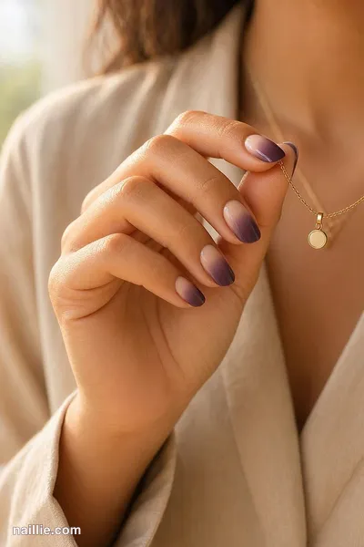 Close-up of short almond nails with a deep plum ombre fading into nude — look 2
