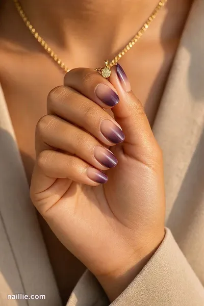Close-up of short almond nails with a deep plum ombre fading into nude — look 3