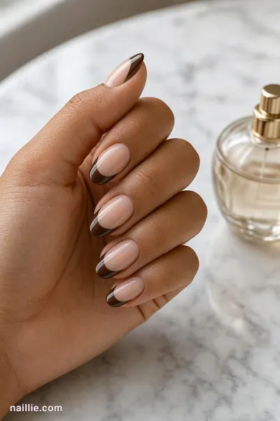 Close-up of oval nails with a espresso brown double French line — look 3