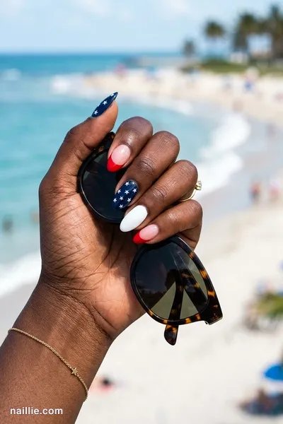 Close-up of almond nails with red, white and blue with tiny stars — look 3