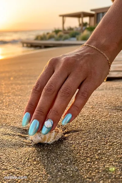 Close-up of oval nails with pearly shells and an aqua shimmer — look 3
