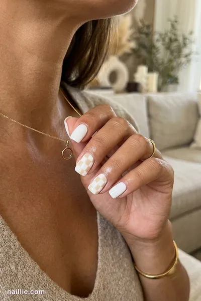 Close-up of short square nails with a milky white and cream checkerboard — look 3