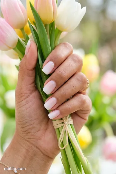 Close-up of short square nails with a milky white ombre fading into nude — look 2