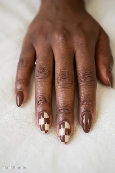 Close-up of almond nails with a mocha and cream checkerboard — look 2