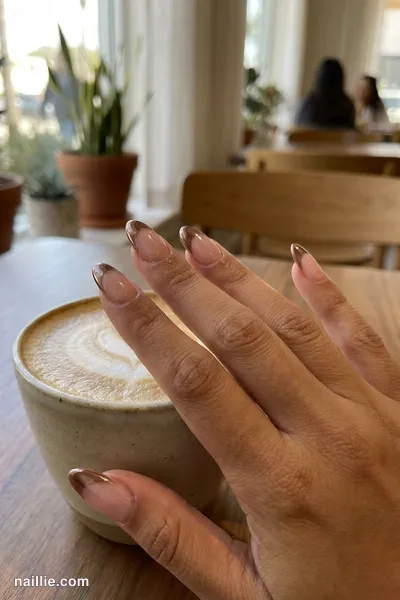 Close-up of almond nails with mocha chrome French tips — look 3