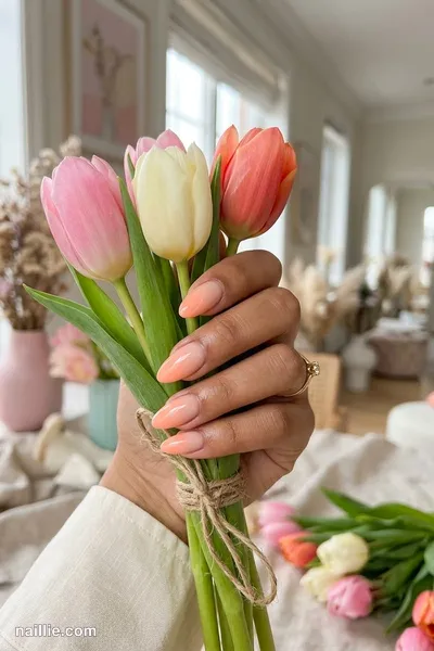 Close-up of almond nails with a peach ombre fading into nude — look 3