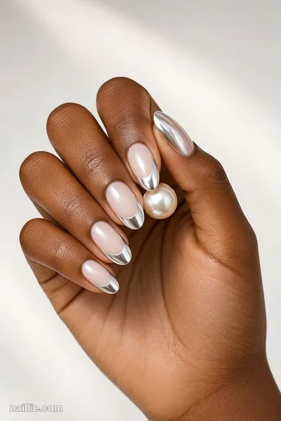 Close-up of oval nails with pearl white chrome French tips — look 2