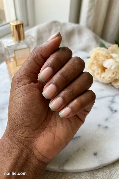 Close-up of short square nails with ultra-thin sage green micro French tips — look 3