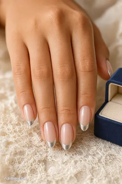 Close-up of almond nails with ultra-thin silver micro French tips — look 2