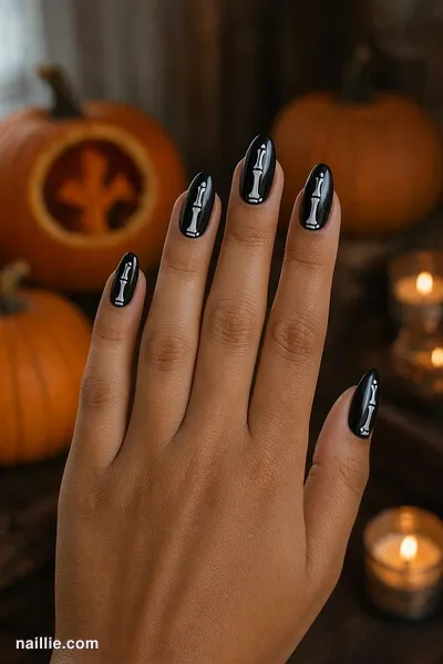 Close-up of almond nails with white skeleton bones on black — look 4
