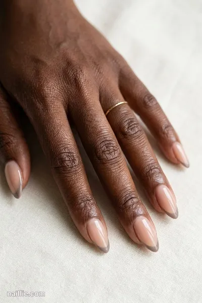 Close-up of almond nails with ultra-thin taupe micro French tips — look 2