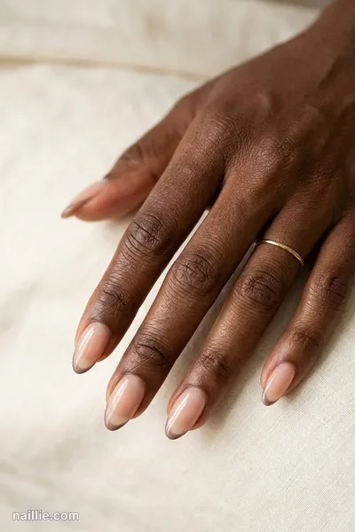 Close-up of almond nails with ultra-thin taupe micro French tips — look 3